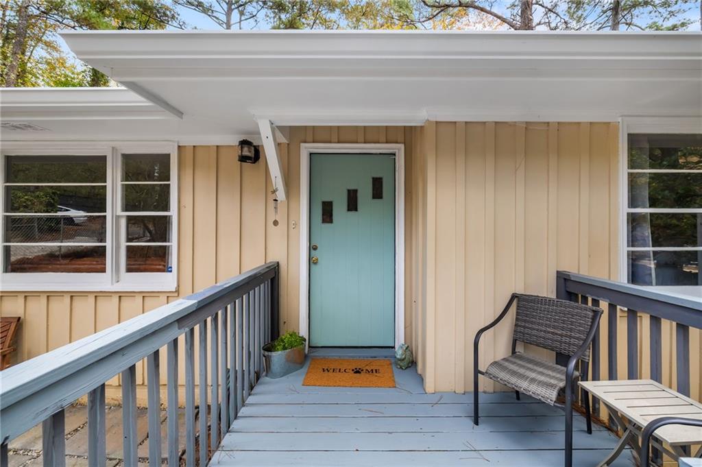 866 Buckner Road Mableton, GA 30126 - Photo 3 of 57 a view of a balcony with furniture and wooden floor