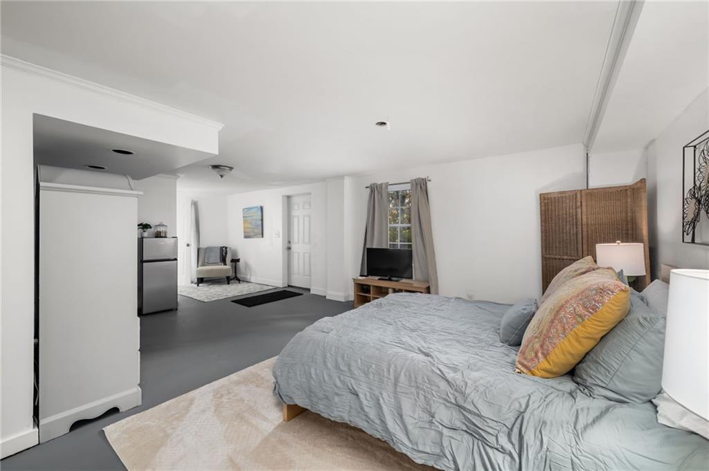 866 Buckner Road Mableton, GA 30126 - Photo 31 of 57 a bedroom with a bed and white cabinets