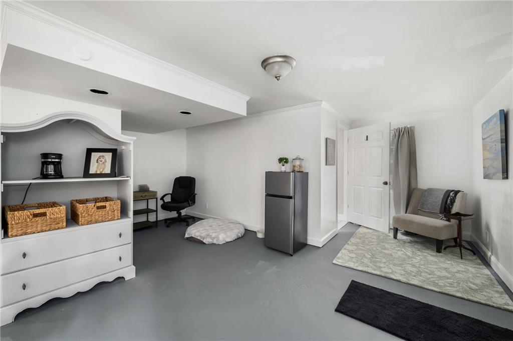 866 Buckner Road Mableton, GA 30126 - Photo 32 of 57 a living room with furniture and a dresser