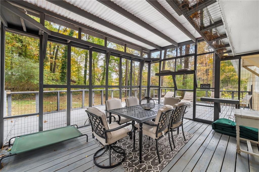 866 Buckner Road Mableton, GA 30126 - Photo 36 of 57 a view of a dining room with furniture window and wooden floor