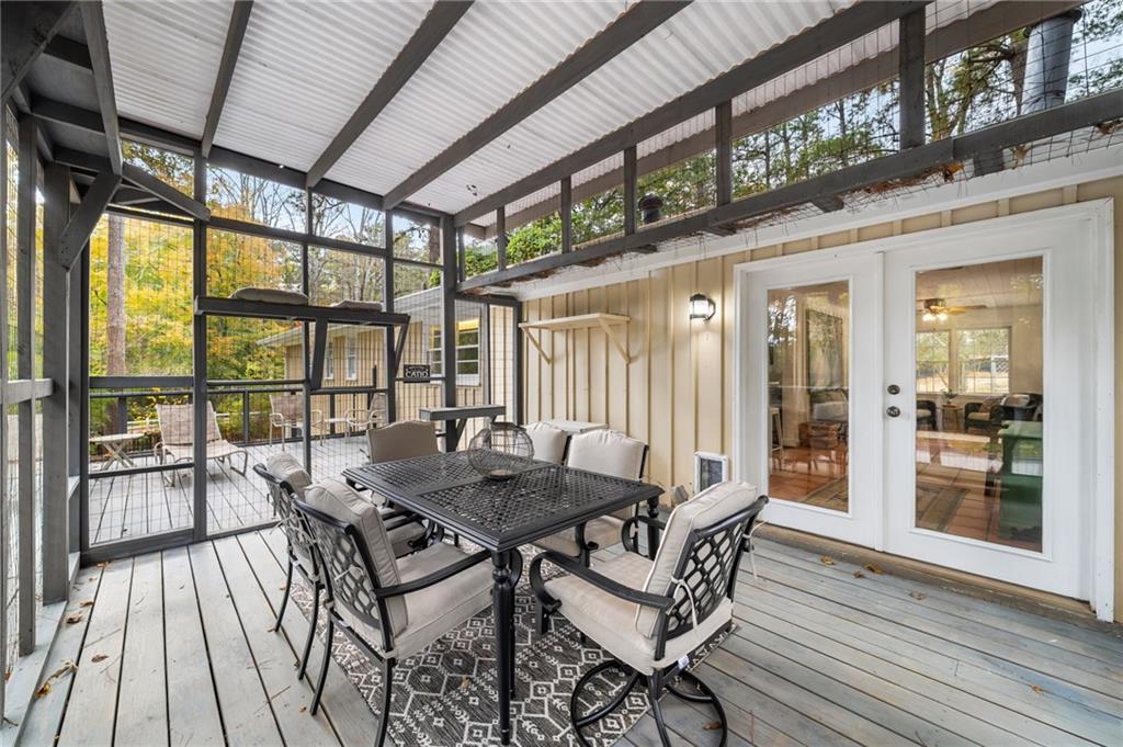 866 Buckner Road Mableton, GA 30126 - Photo 37 of 57 a view of a patio with table and chairs and wooden floor