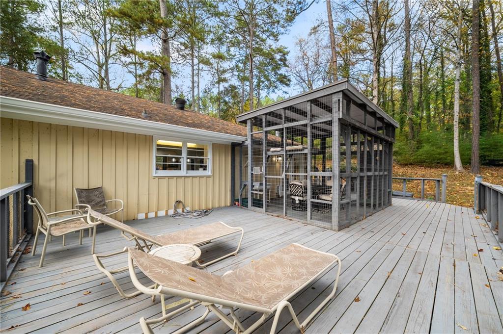 866 Buckner Road Mableton, GA 30126 - Photo 38 of 57 a wooden bench sitting in front of a house