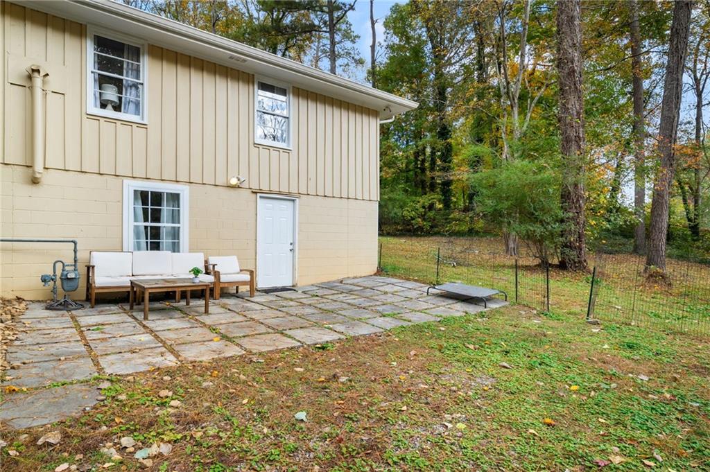 866 Buckner Road Mableton, GA 30126 - Photo 42 of 57 a backyard of a house with table and chairs