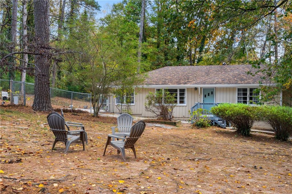 866 Buckner Road Mableton, GA 30126 - Photo 55 of 57 a view of a house with backyard sitting area and garden