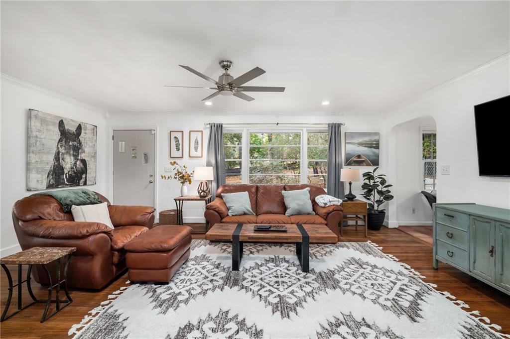 866 Buckner Road Mableton, GA 30126 - Photo 6 of 57 a living room with furniture ceiling fan and a rug