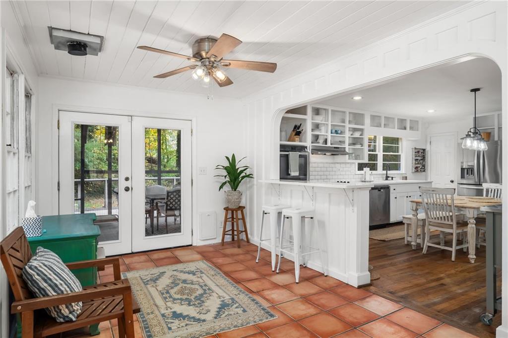 866 Buckner Road Mableton, GA 30126 - Photo 10 of 57 a living room with furniture a dining table and a large window