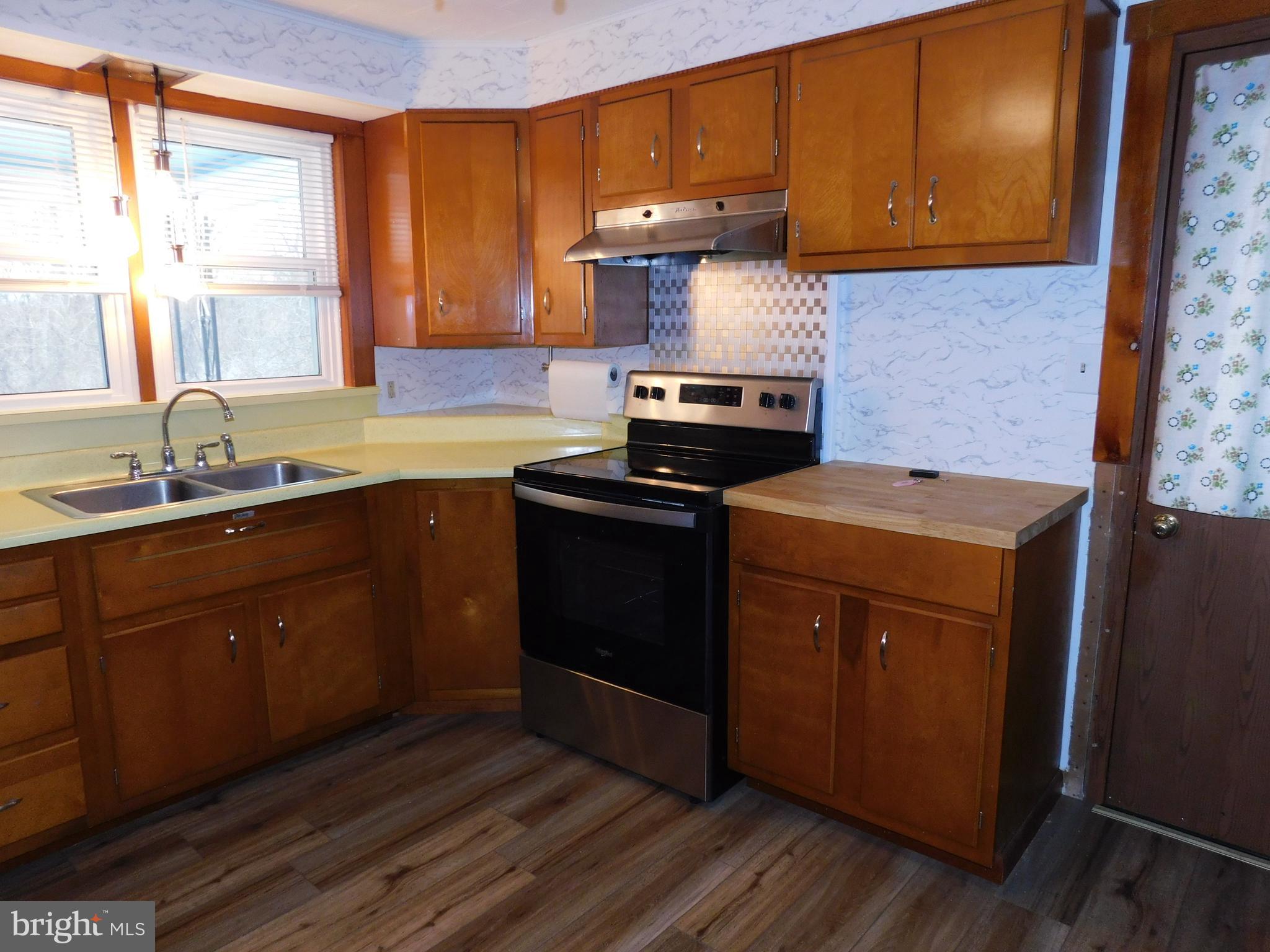 122 Loop Road Lewistown, PA 17044 - Photo 8 of 41 a kitchen with a sink stove and cabinets