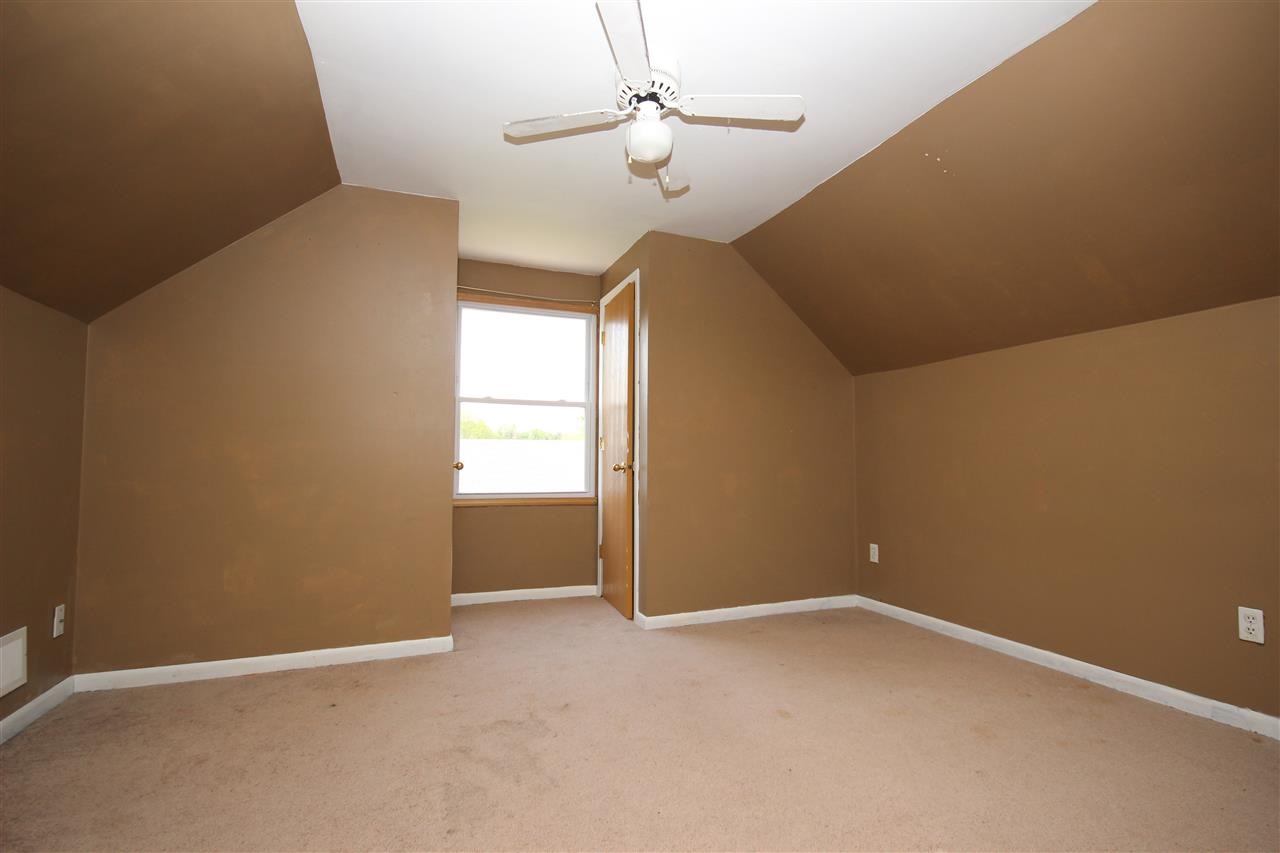 405 Pembroke Road Southwest Poplar Grove, IL 61065 - Photo 14 of 21 a view of an empty room with a window