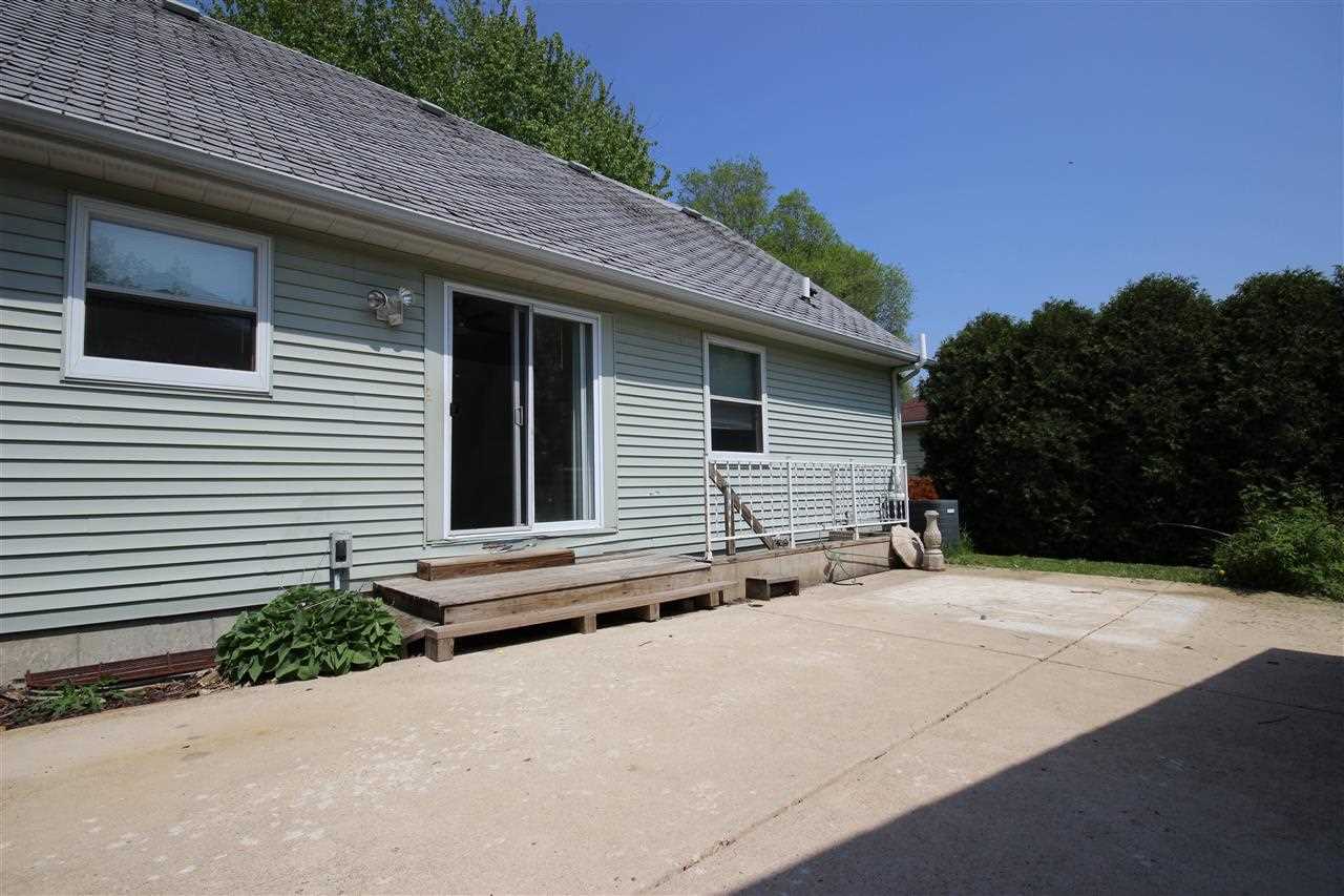405 Pembroke Road Southwest Poplar Grove, IL 61065 - Photo 17 of 21 a backyard of a house with plants and trees