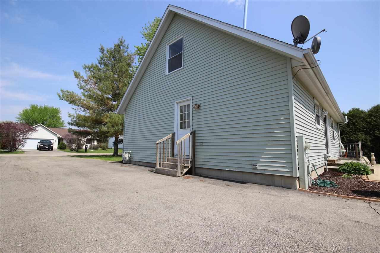 405 Pembroke Road Southwest Poplar Grove, IL 61065 - Photo 18 of 21 a view of a house with backyard and parking area