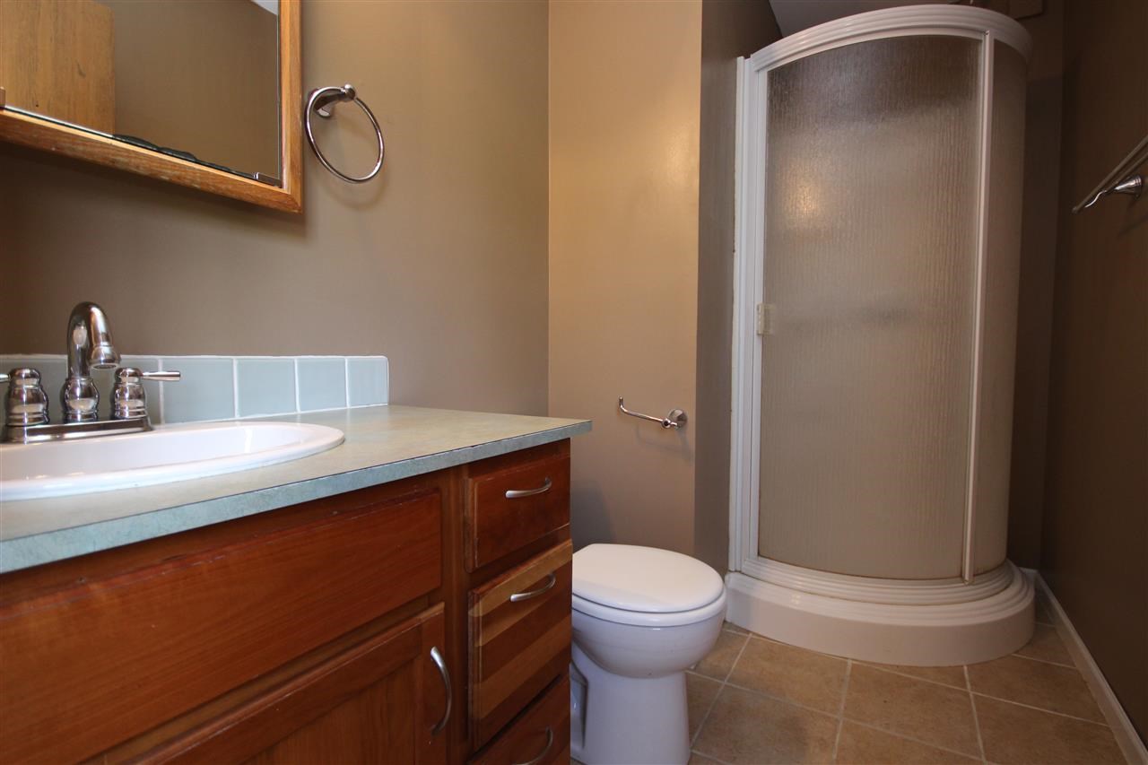 405 Pembroke Road Southwest Poplar Grove, IL 61065 - Photo 6 of 21 a bathroom with a sink a toilet and shower