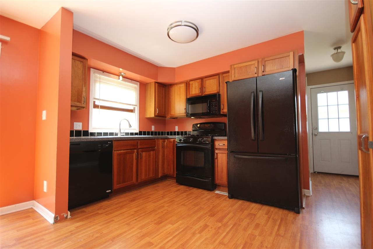 405 Pembroke Road Southwest Poplar Grove, IL 61065 - Photo 7 of 21 a kitchen with stainless steel appliances granite countertop a refrigerator a sink and dishwasher
