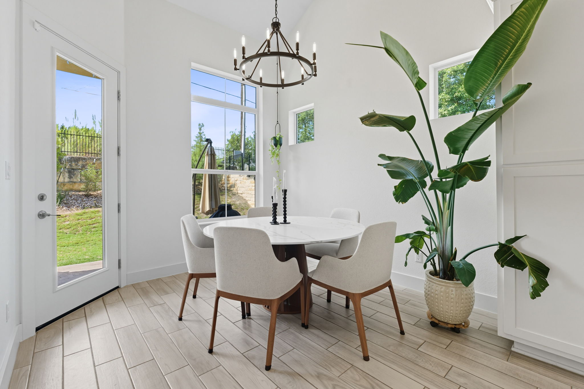 101 Cartwheel Bend, Unit 52 Austin, TX 78738 - Photo 12 of 29 a view of a dining room with furniture window and wooden floor