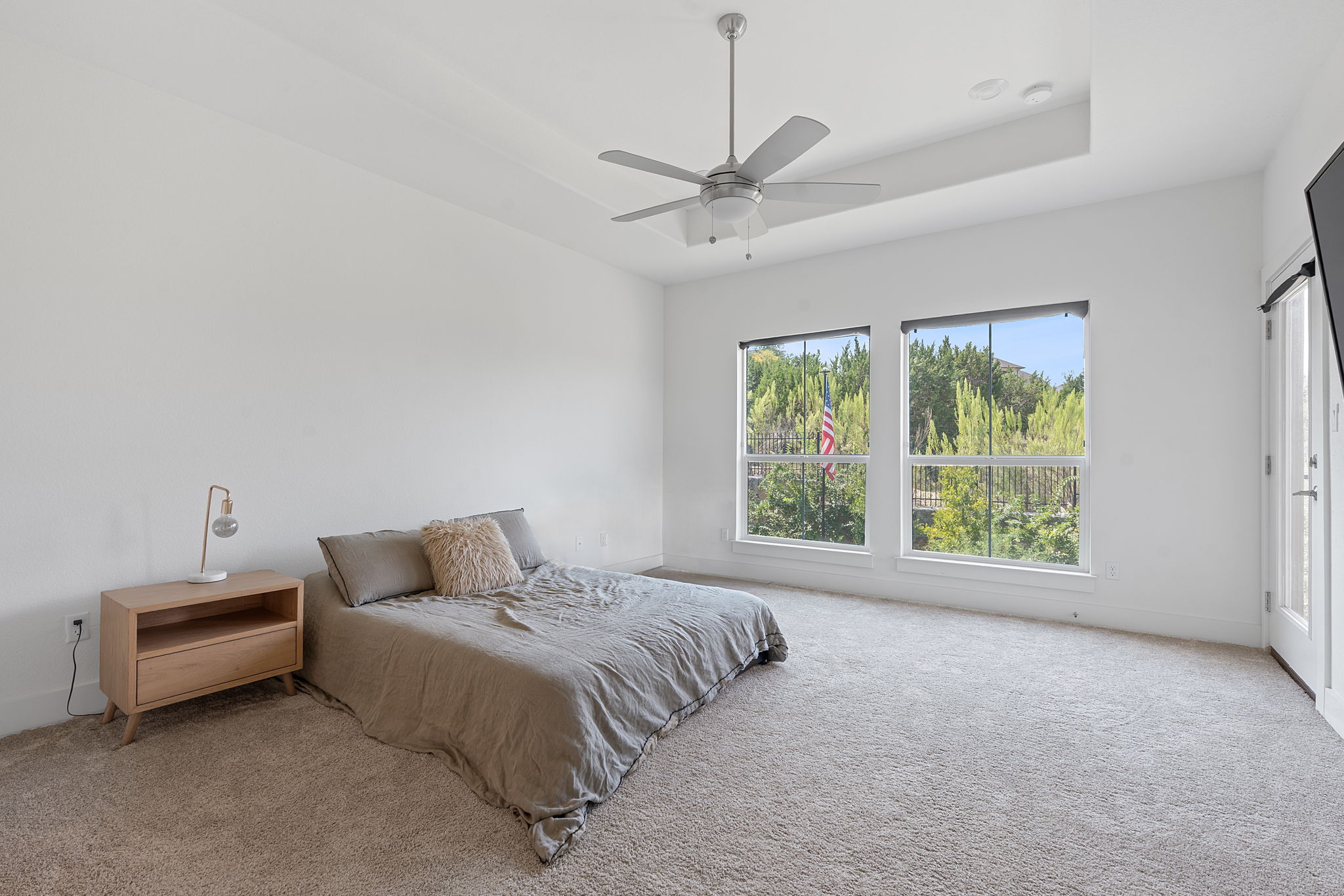 101 Cartwheel Bend, Unit 52 Austin, TX 78738 - Photo 20 of 29 a bedroom with a bed and a window