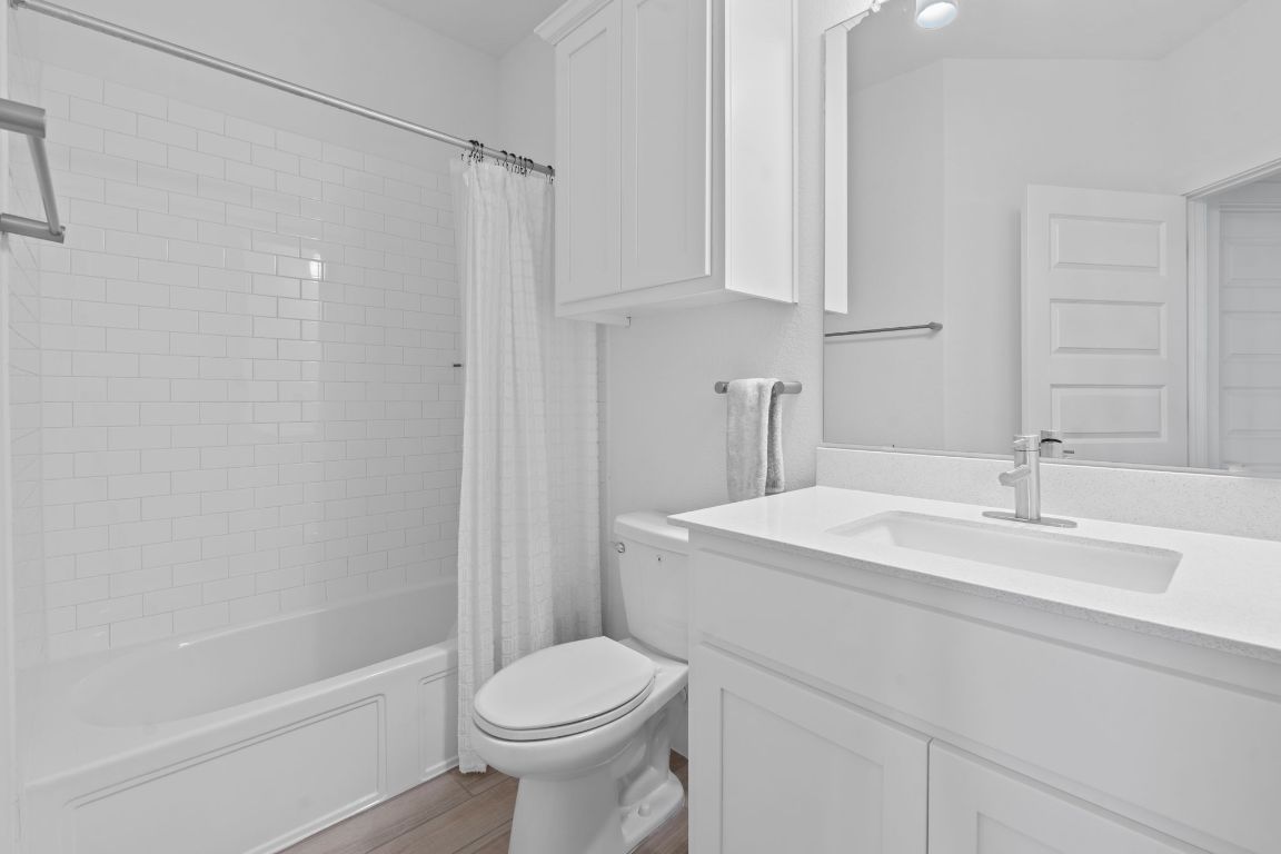 101 Cartwheel Bend, Unit 52 Austin, TX 78738 - Photo 24 of 31 a bathroom with a sink a toilet and shower