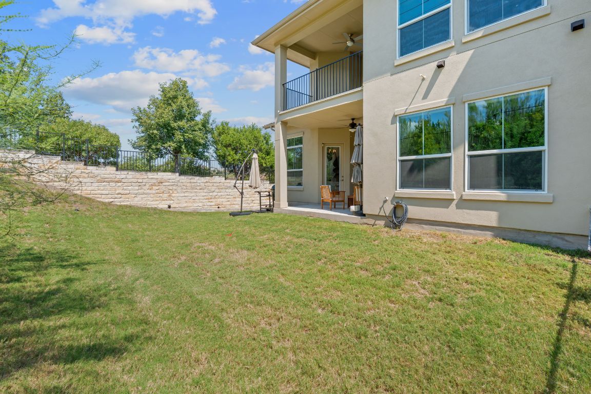 101 Cartwheel Bend, Unit 52 Austin, TX 78738 - Photo 26 of 31 a view of a house with backyard and porch