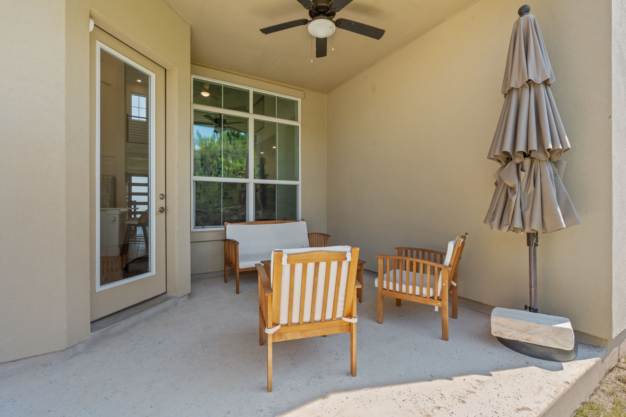 101 Cartwheel Bend, Unit 52 Austin, TX 78738 - Photo 26 of 29 a living room with furniture and a window