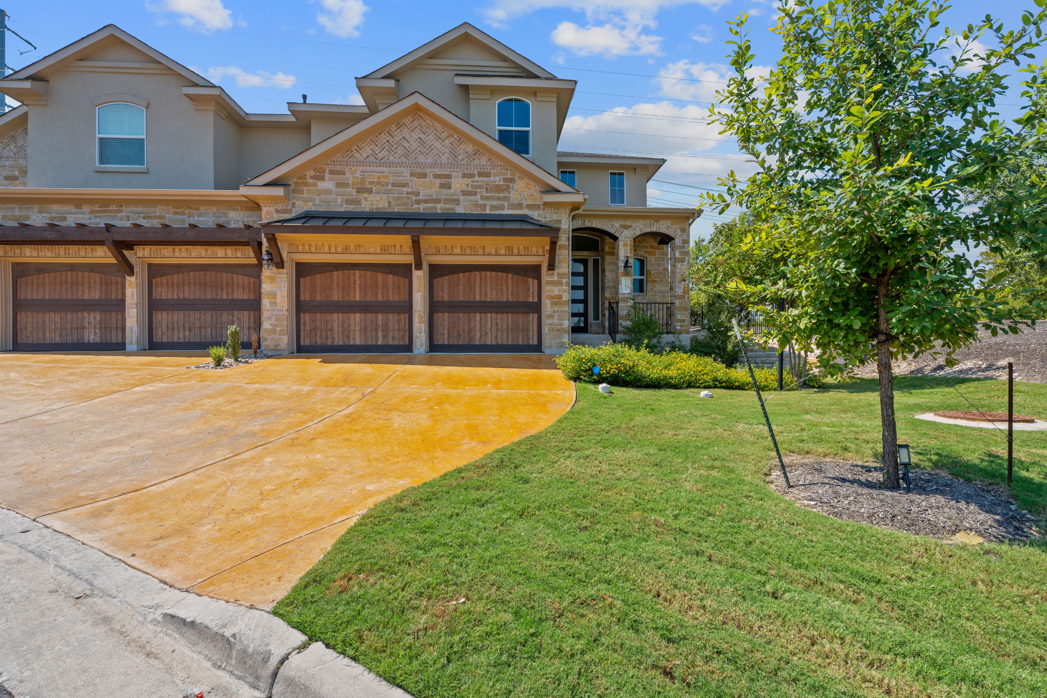 101 Cartwheel Bend, Unit 52 Austin, TX 78738 - Photo 29 of 29 a view of a house with a yard and palm trees