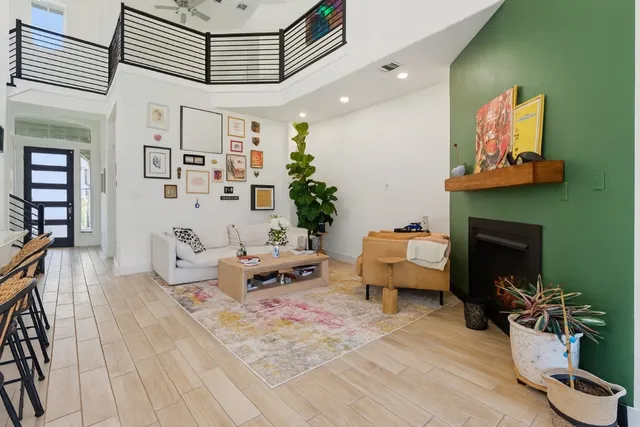a living room with furniture and a fireplace