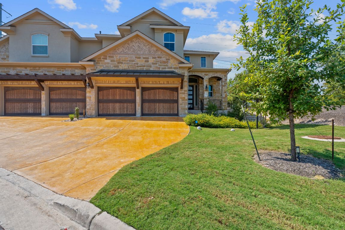 101 Cartwheel Bend, Unit 52 Austin, TX 78738 - Photo 31 of 31 a view of a house with a yard and tree s