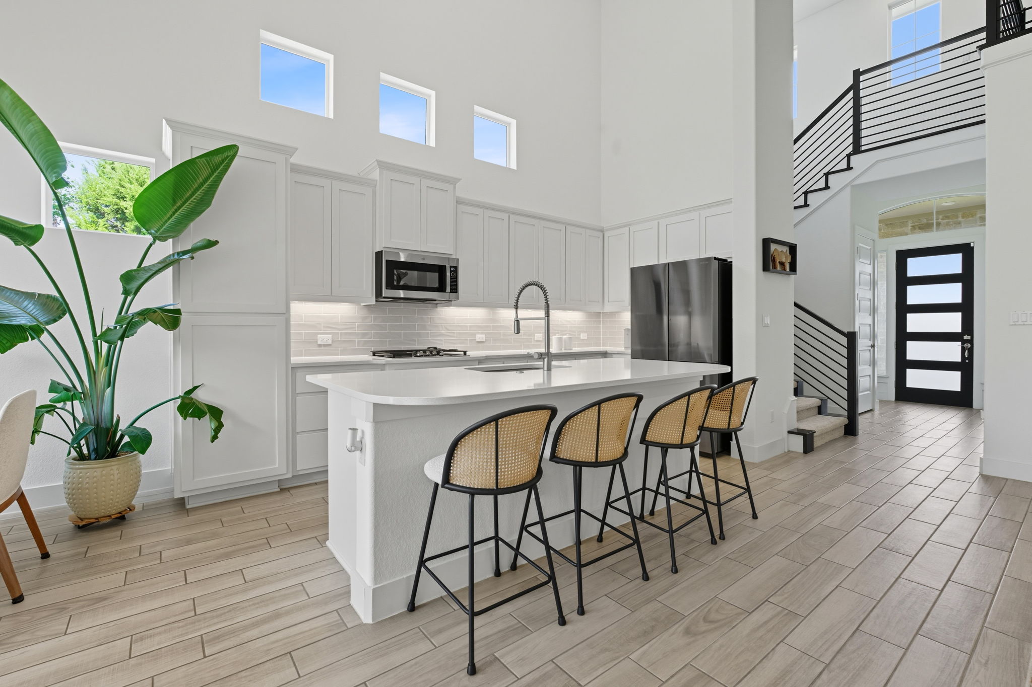 101 Cartwheel Bend, Unit 52 Austin, TX 78738 - Photo 6 of 29 a dining room with furniture and a kitchen view