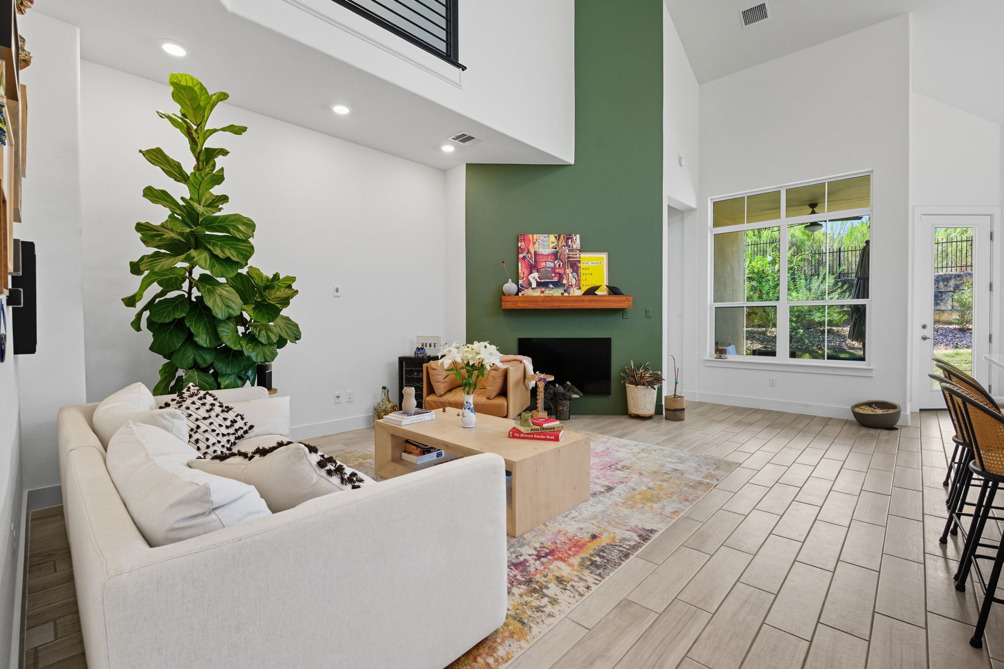 101 Cartwheel Bend, Unit 52 Austin, TX 78738 - Photo 10 of 29 a living room with furniture and a potted plant