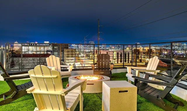a view of a chairs and table in patio