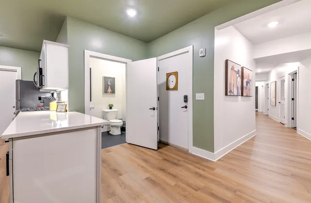 a view of a chairs and table in patio with a yard