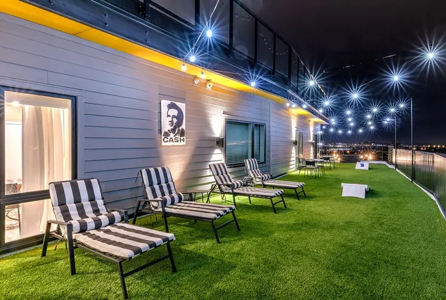 a backyard with table and chairs