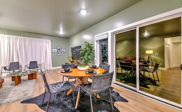 a dining room with furniture and window