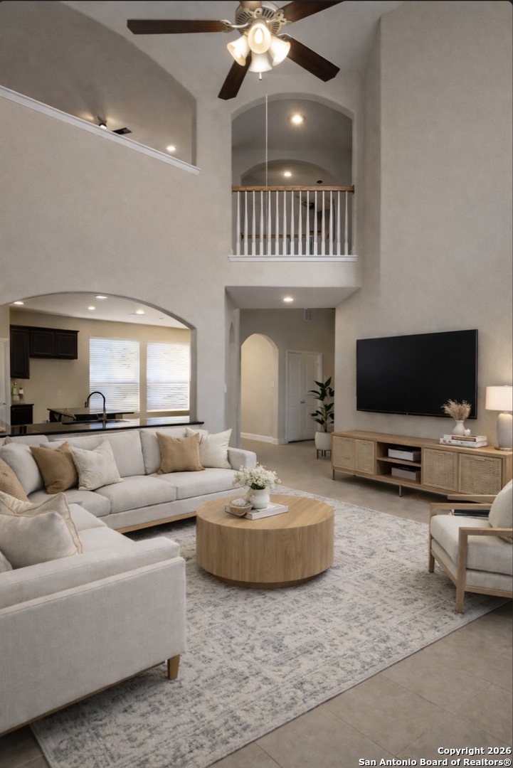 12138 Pinon Ranch San Antonio, TX 78254 - Photo 2 of 4 a living room with furniture and a flat screen tv