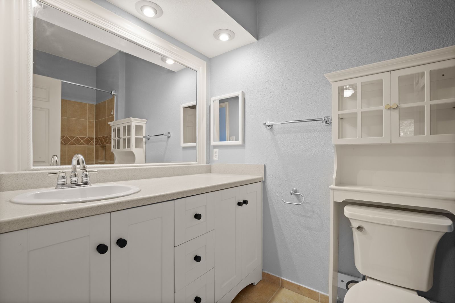 11970 Jollyville Road, Unit 216 Austin, TX 78759 - Photo 13 of 20 Full bathroom featuring vanity, a textured wall, a shower, and light tile patterned floors