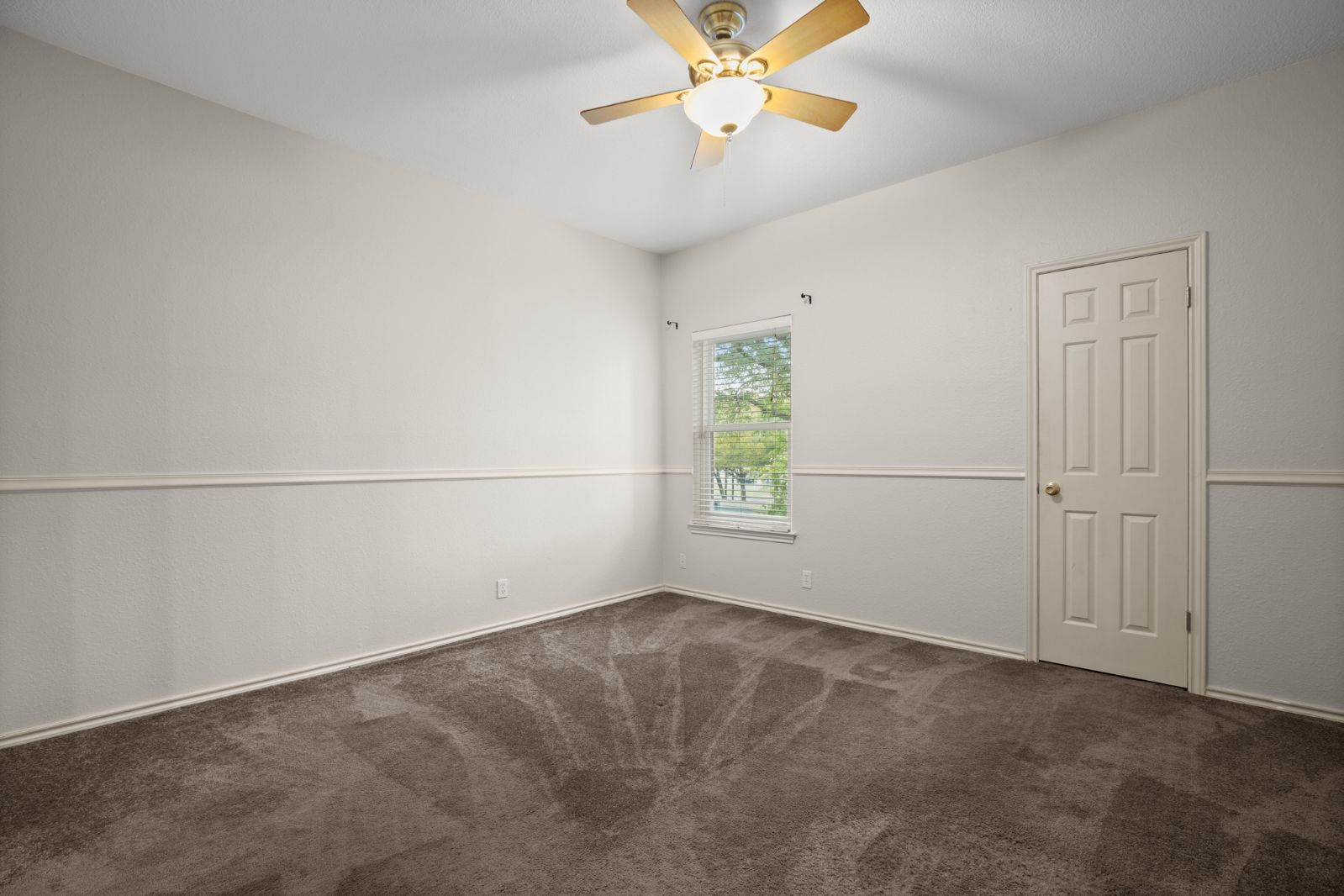 11970 Jollyville Road, Unit 216 Austin, TX 78759 - Photo 15 of 20 Unfurnished room with dark colored carpet and ceiling fan