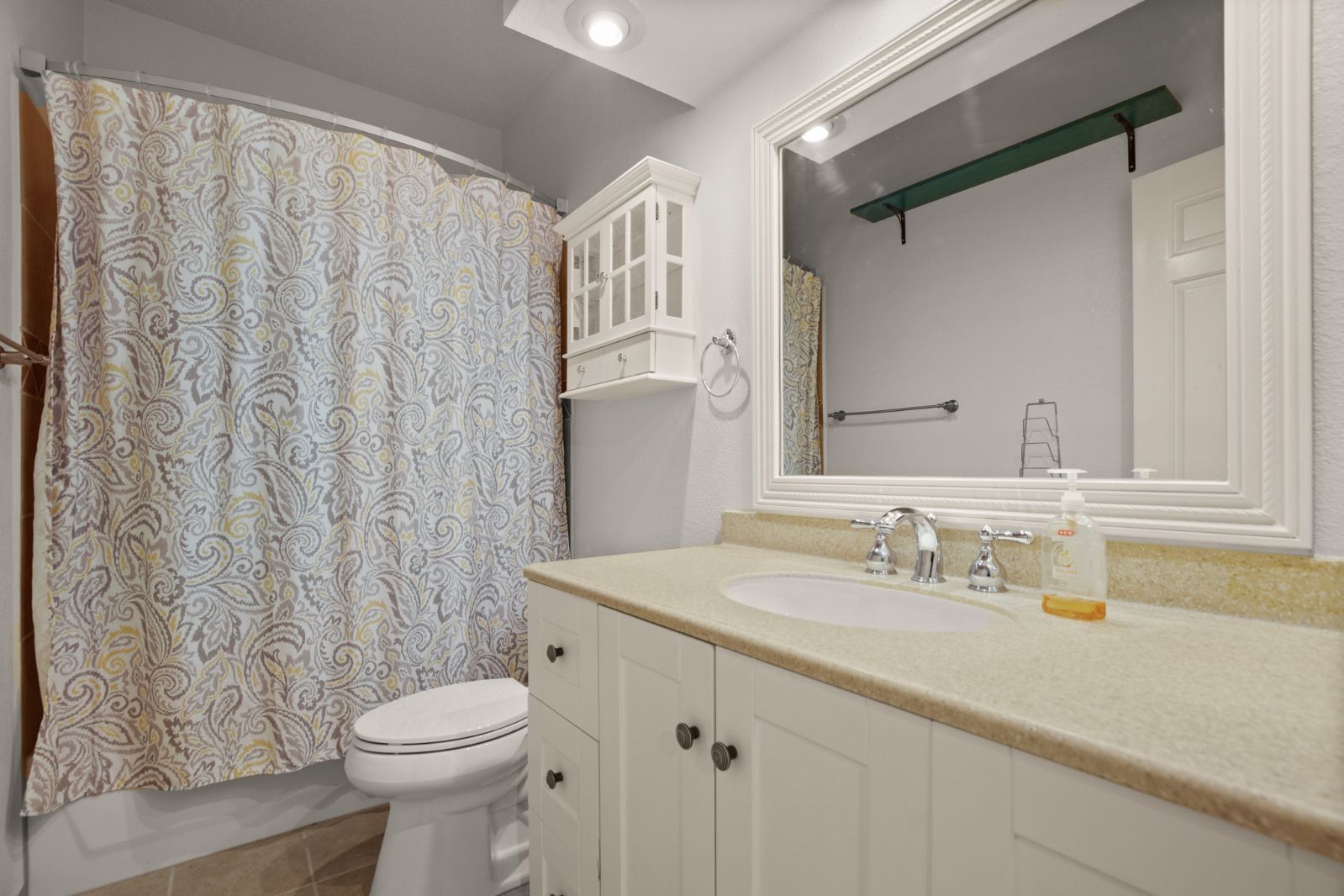 11970 Jollyville Road, Unit 216 Austin, TX 78759 - Photo 16 of 20 Full bath with vanity, tile patterned flooring, and shower / bath combination with curtain