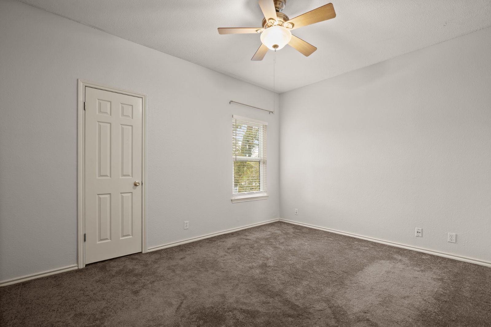 11970 Jollyville Road, Unit 216 Austin, TX 78759 - Photo 17 of 20 Unfurnished room featuring dark colored carpet and a ceiling fan