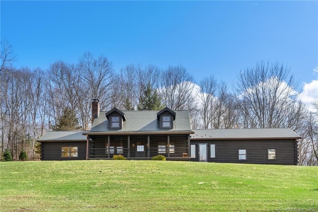 22 Tamarack Road New Milford, CT 06776 - Photo 1 of 1 a view of a building with a garden