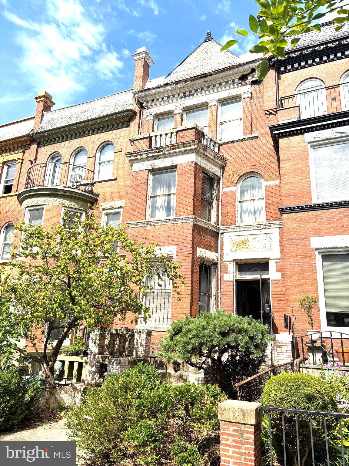2306 1st Street Northwest Washington, DC 20001 - Photo 1 of 6 Charming brick facade with lush greenery.
