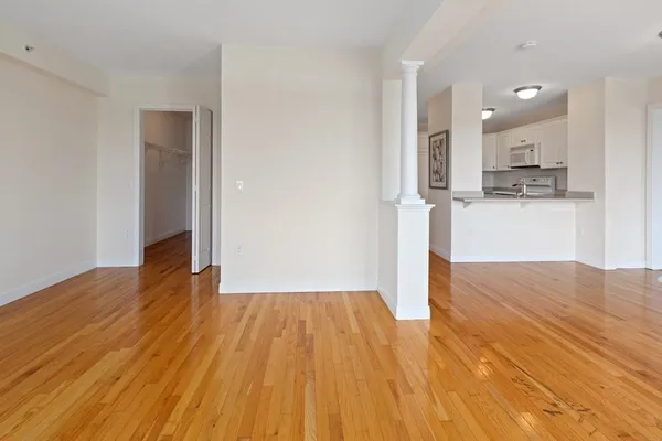 a view of a kitchen with wooden floor
