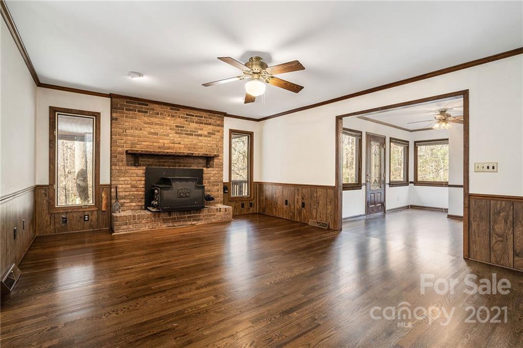 3903 Tater Ridge Road Concord, NC 28025 - Photo 12 of 34 a view of a livingroom with furniture wooden floor fireplace and a window