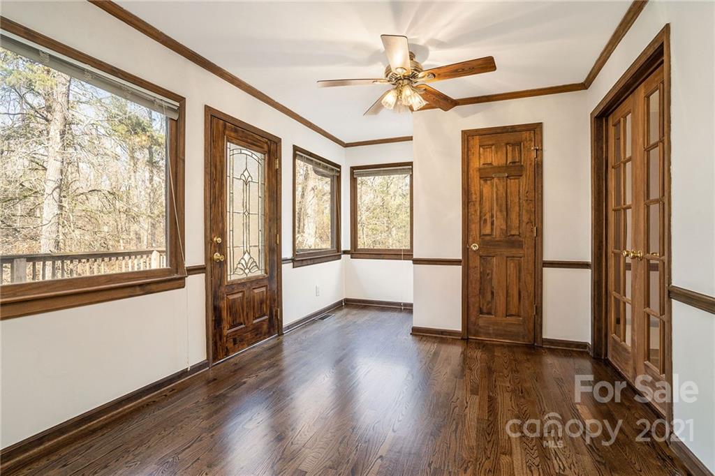 3903 Tater Ridge Road Concord, NC 28025 - Photo 13 of 34 a view of an empty room with a window and wooden floor