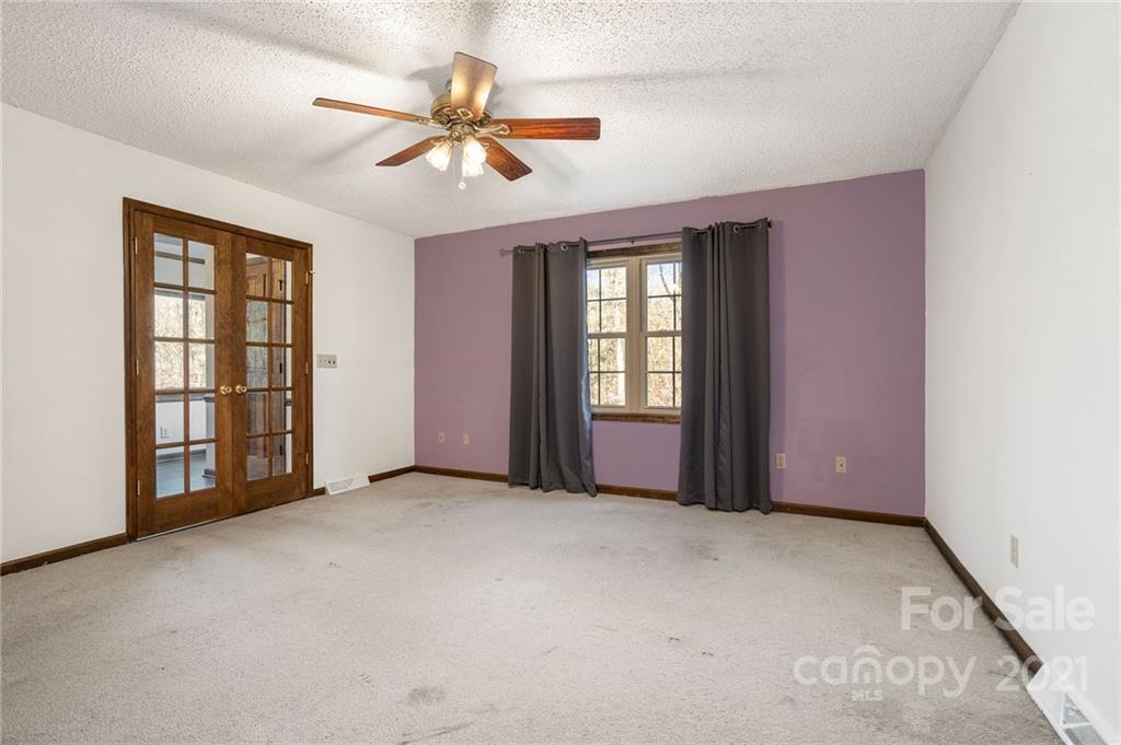 3903 Tater Ridge Road Concord, NC 28025 - Photo 14 of 34 an empty room with windows and fan