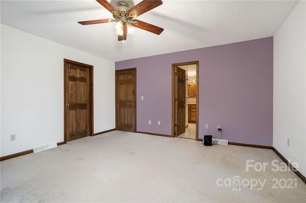 3903 Tater Ridge Road Concord, NC 28025 - Photo 15 of 34 an empty room with windows and fan
