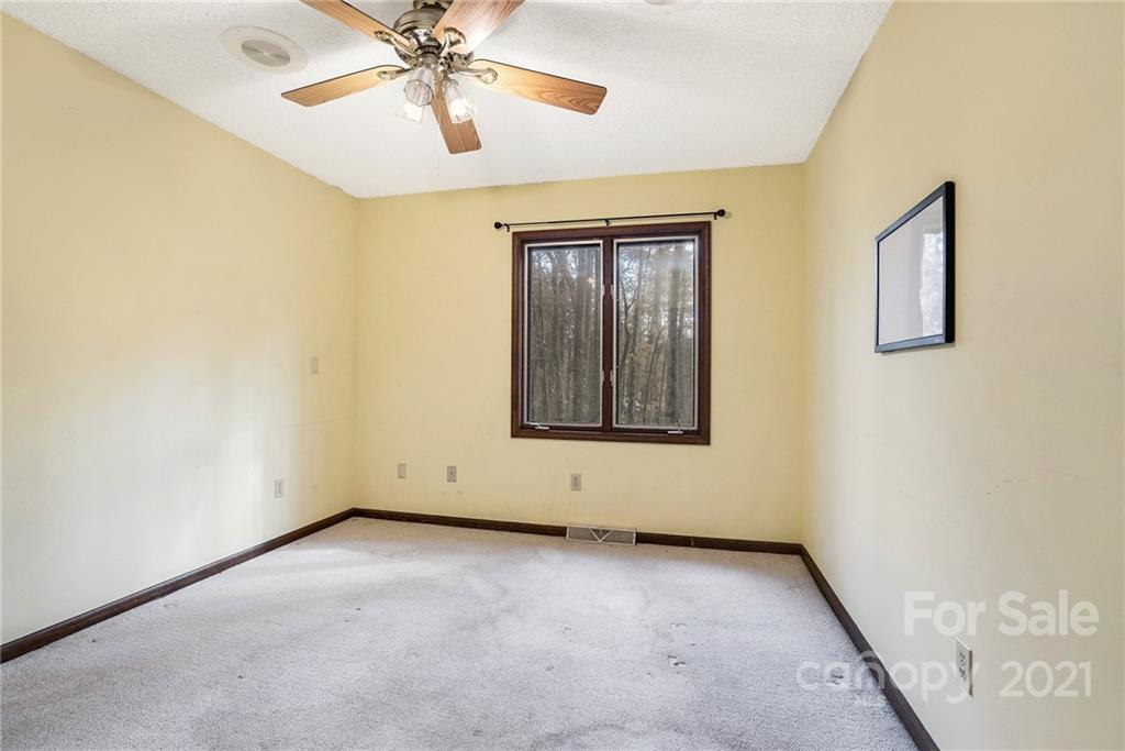 3903 Tater Ridge Road Concord, NC 28025 - Photo 18 of 34 an empty room with windows and fan