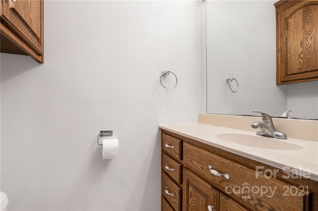 3903 Tater Ridge Road Concord, NC 28025 - Photo 20 of 34 a bathroom with a sink and a mirror