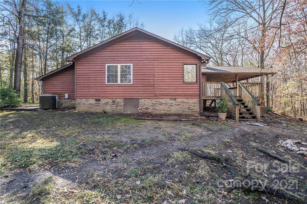 3903 Tater Ridge Road Concord, NC 28025 - Photo 22 of 34 a view of a small house with a yard
