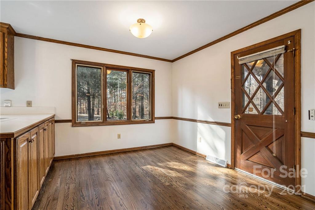 3903 Tater Ridge Road Concord, NC 28025 - Photo 5 of 34 a view of an empty room with window wooden floor and a sink