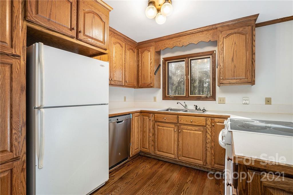 3903 Tater Ridge Road Concord, NC 28025 - Photo 7 of 34 a kitchen with stainless steel appliances granite countertop a refrigerator sink and cabinets