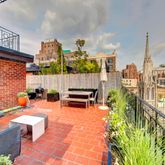 a bench sitting in front of a building