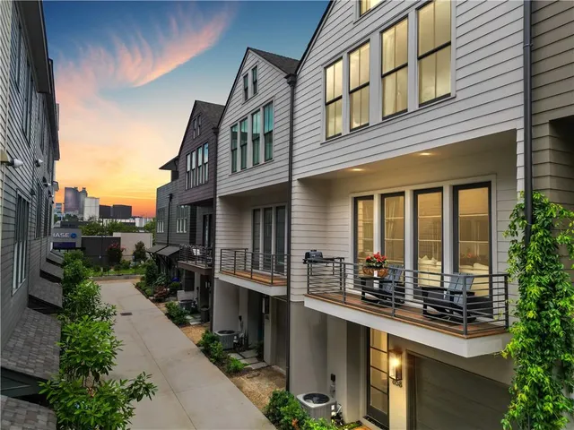a front view of a house with lots of green space