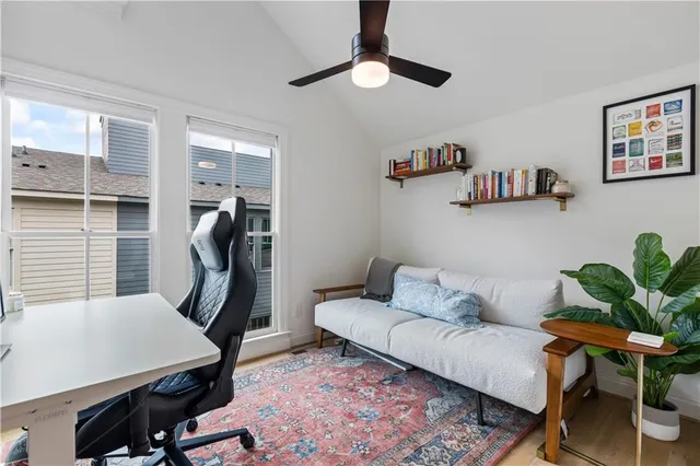 a living room with furniture a rug and a chandelier